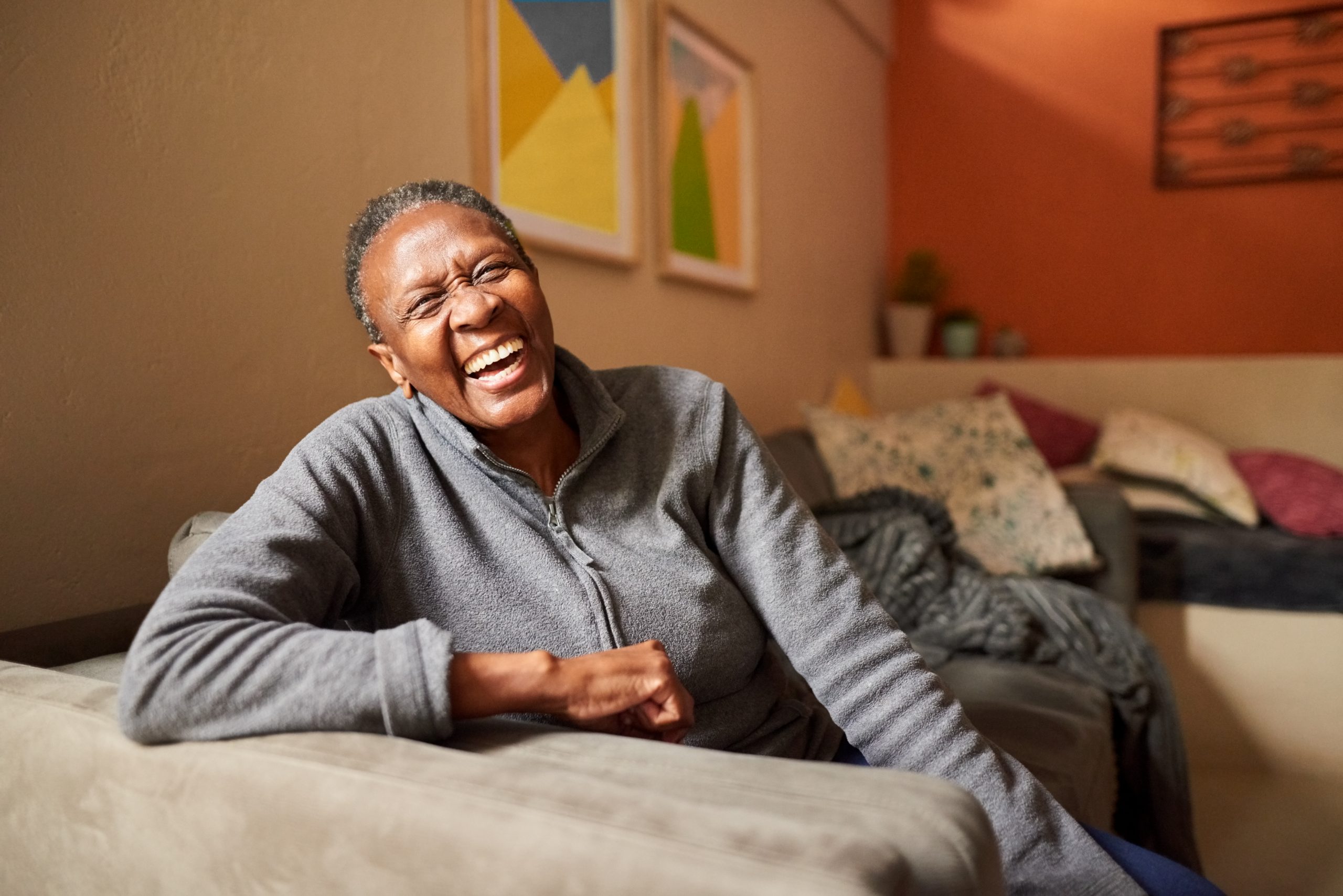 older woman at home laughing
