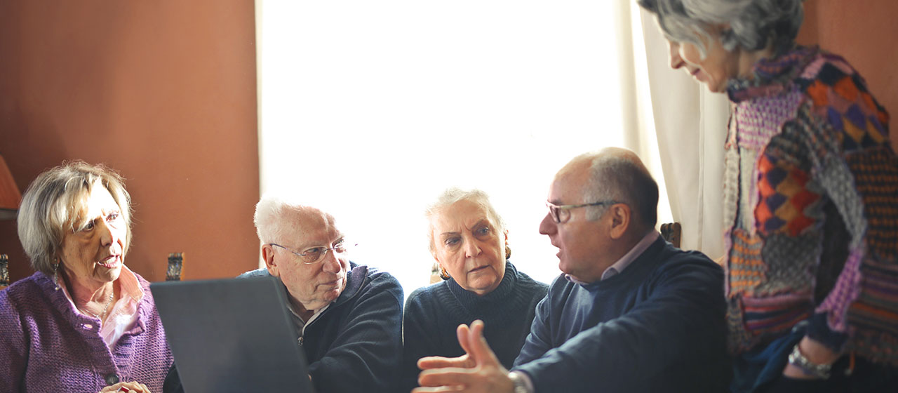 A group of older people in discussion