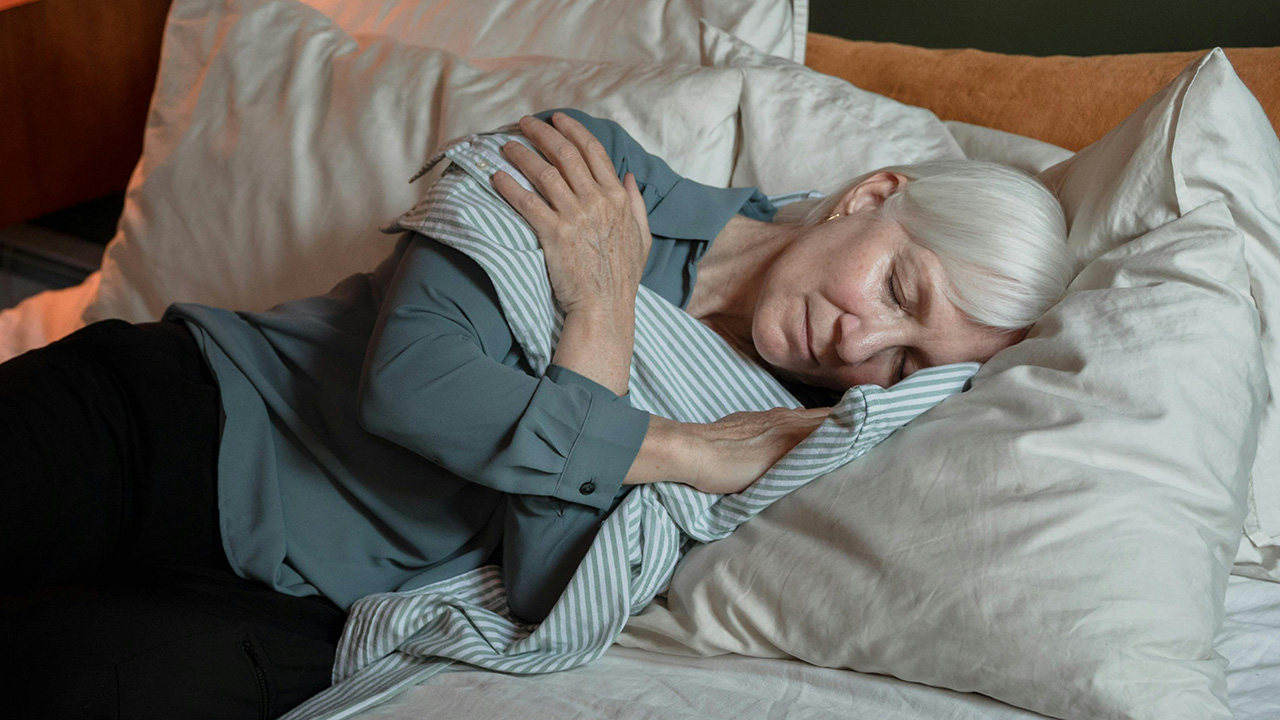 Woman sleeping on bed